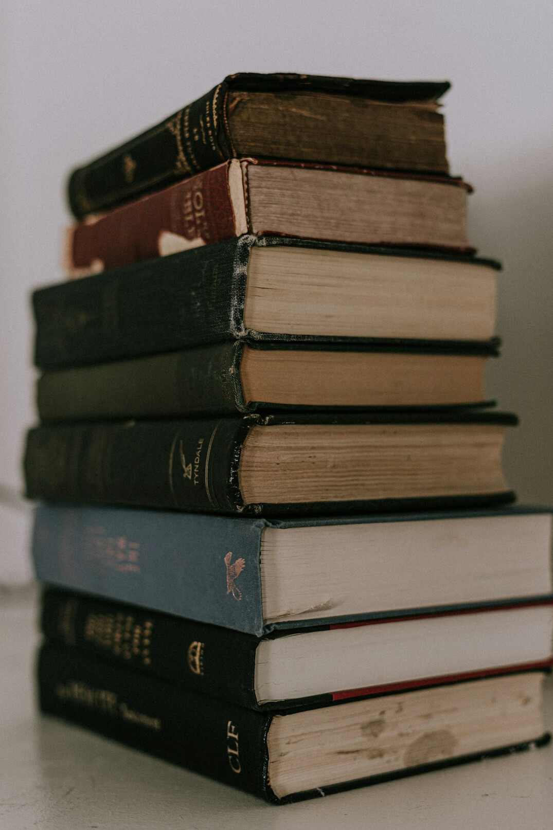 Stack of old books on a table
