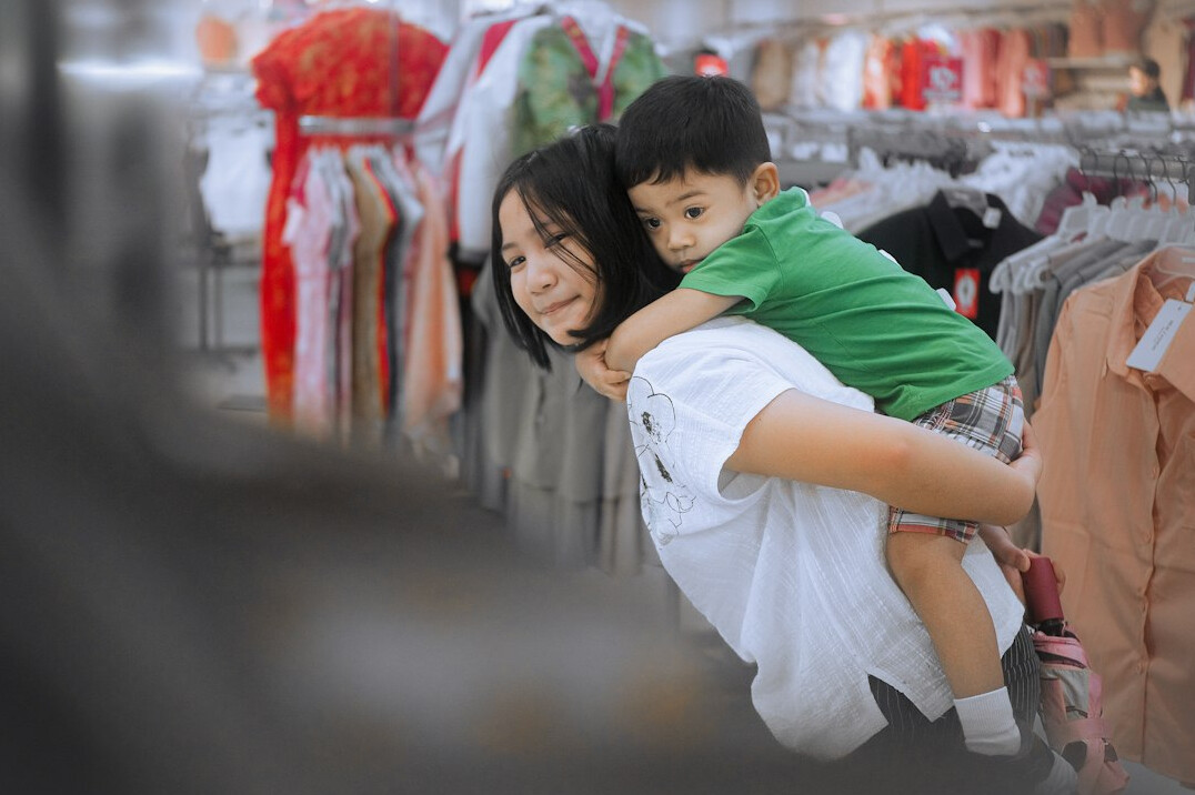 parent with child in store